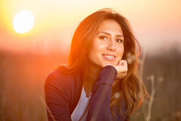 istock Young happy woman enjoying sunlight 485584413