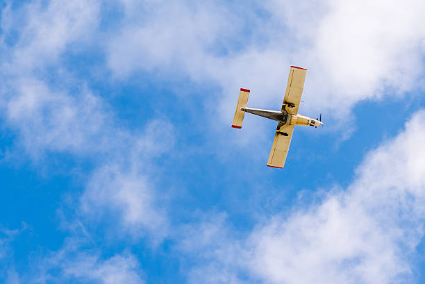 istock Small sport plane from below with blue sky 485586755