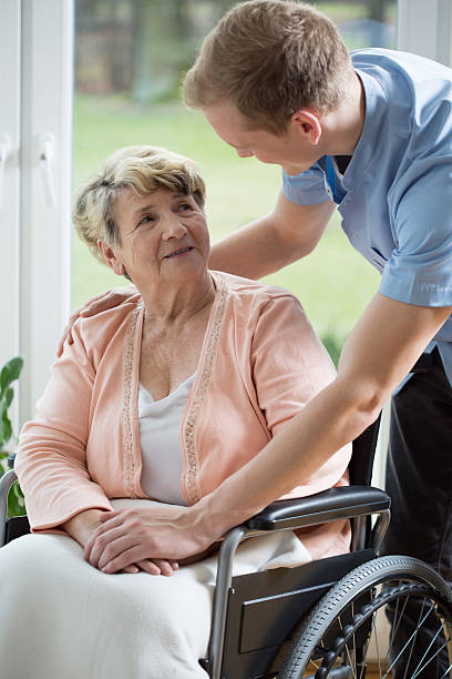 istock Male nurse and older woman 485587292