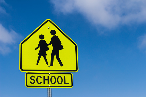 School Warning Sign with the sky background