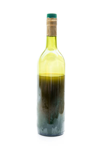istock red Wine in glass bottle isolated on white background 485587870