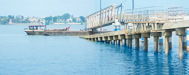 istock Jetty Ghat with a Boat carrying some person. 485589222