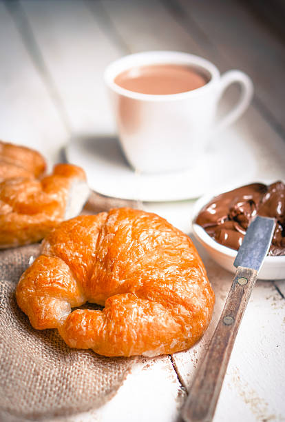 istock Fresh baked croissants with chocolate cream and hot cocoa 485589633