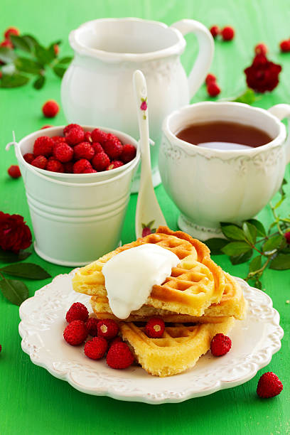 istock Homemade waffles with wild strawberries. . 485591472