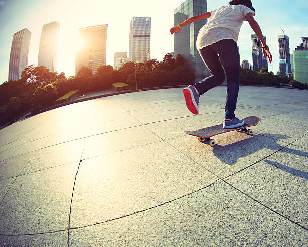 istock skateboarder skateboarding at sunrise city 485591484