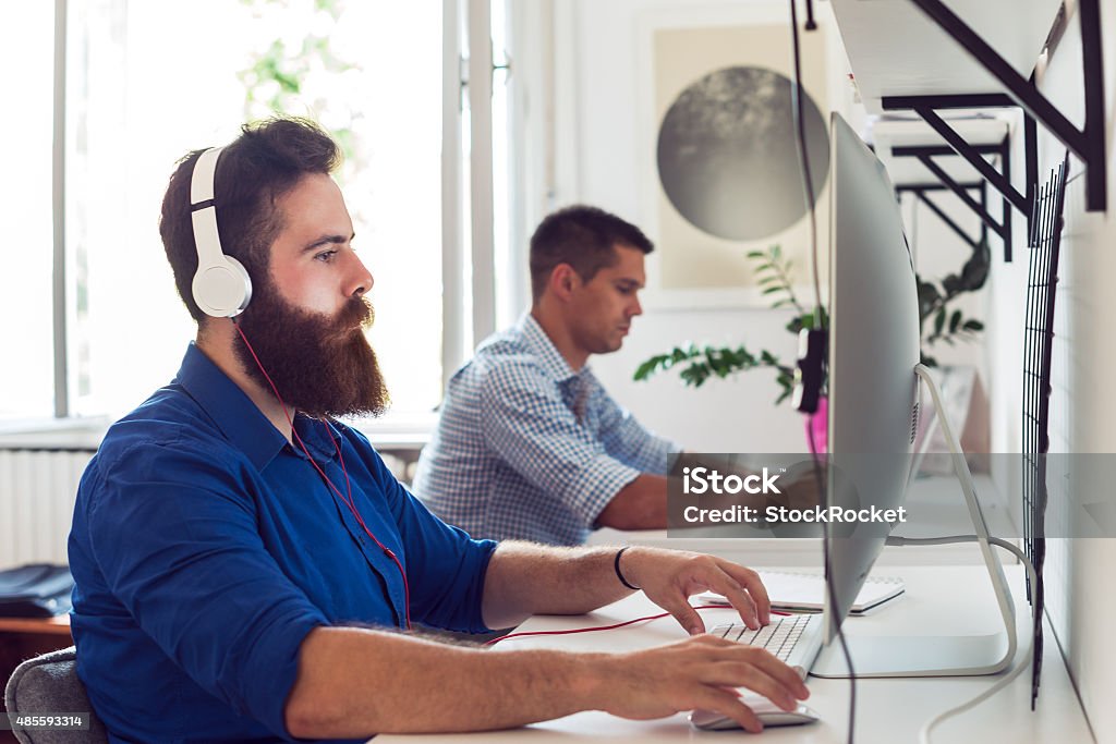 Young programmer Young man working on laptop 2015 Stock Photo