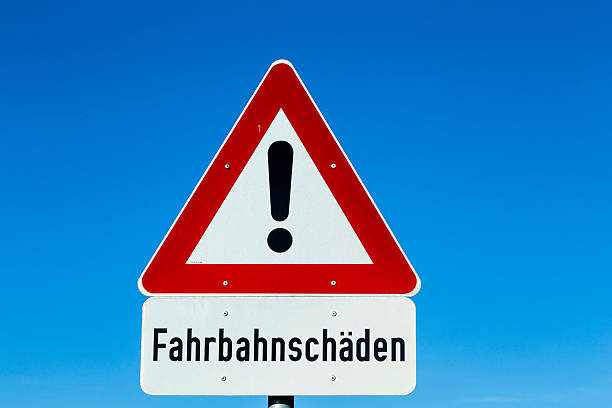 istock street sign - Street Damage -  with warning icon 485594436
