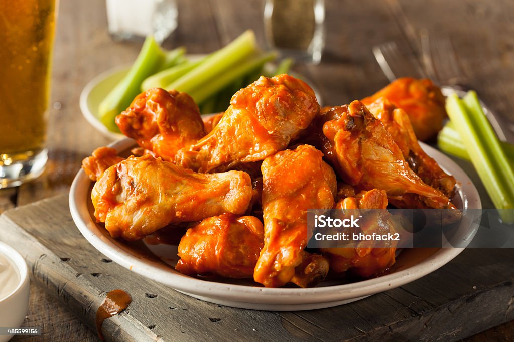 Spicy Homemade Buffalo Wings Spicy Homemade Buffalo Wings with Dip and Beer Chicken Wing Stock Photo