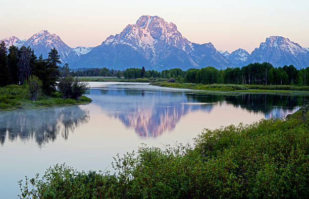 istock Beautiful snow capped mountain reflected in still lake. 485599264