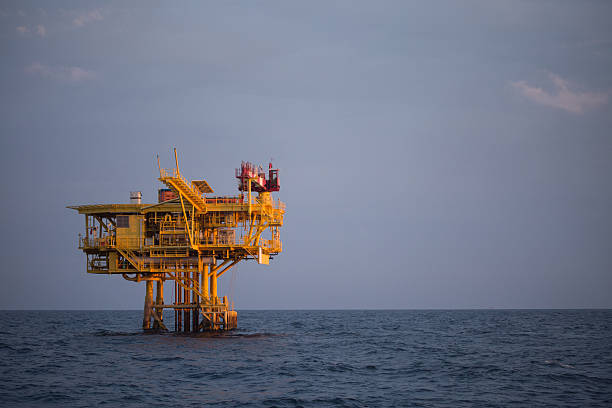 istock Offshore oil and rig platform in sunset or sunrise time. 485602694