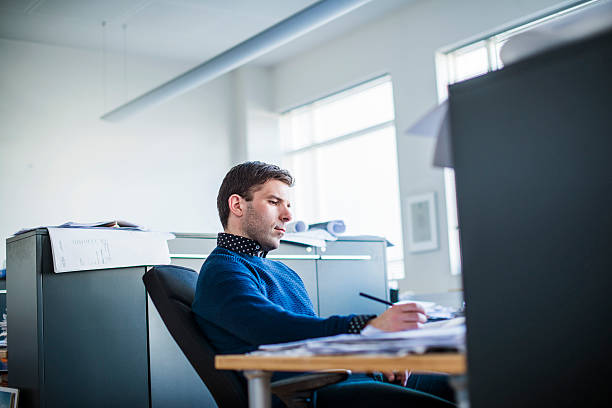 istock Concentrated businessman working in office 485604542