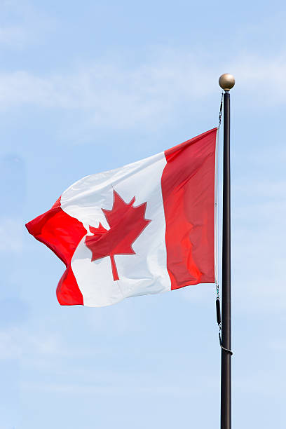 istock Canadian Flag Flying on a Flagpole Outdoors. 485608452