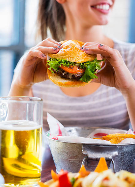 istock Young Woman and Burger 485608781