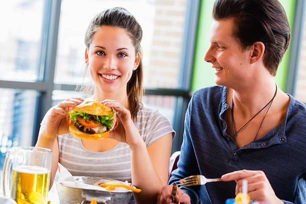 istock Young Woman and Burger 485608801