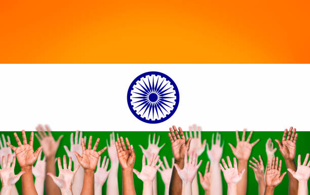 istock Group of Multi-Ethnic People's Hands Raised Front of Indian Flag 485609305