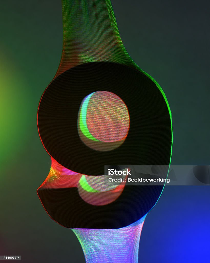 Neon colored nr 9 Number illuminated with primal colors Blue Stock Photo