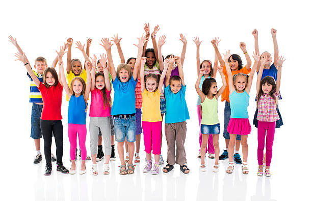 istock Group of cheerful children with raised hands looking at camera. 485610288