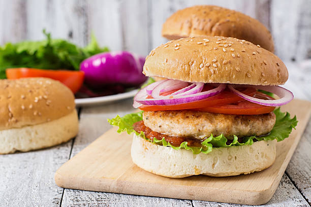 istock Sandwich with chicken burger, tomatoes, red onion and lettuce 485610460