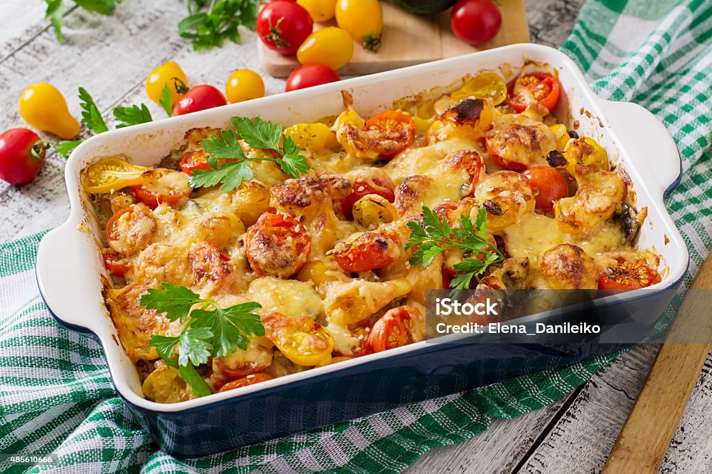 Vegetarian Vegetable casserole with zucchini, mushrooms and cherry tomatoes 2015 Stock Photo
