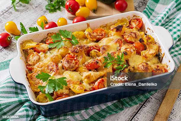Vegetarian Vegetable Casserole With Zucchini Mushrooms And Cherry Tomatoes Stock Photo - Download Image Now