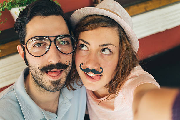 istock Couple making selfie with mustaches 485611688