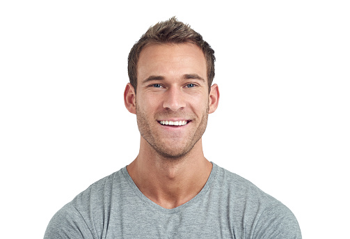 Good luck. Happy overjoyed tanned handsome man in basic t-shirt clenches his fists posing isolated on over white studio background. Copy space Banner Mockup. People emotions Lifestyle concept