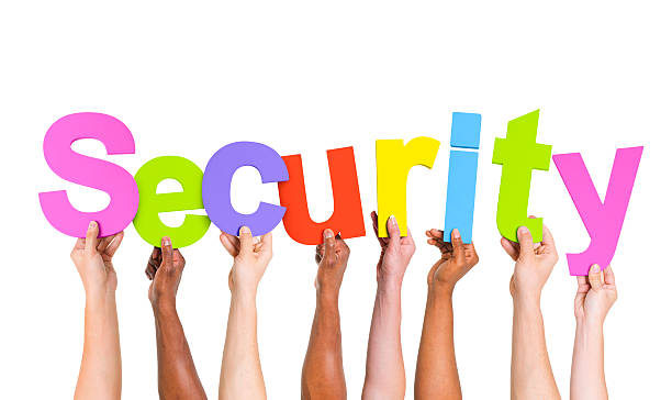 istock Multi-Ethnic Hands Holding Colorful Letters To Form Security 485613581