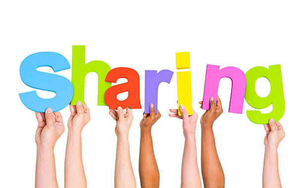 istock Multi-Ethnic Group of People Holding Letters To Form A Sharing 485613627