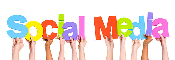 Multi-Ethnic Group Of People Holding The Word Social Media
