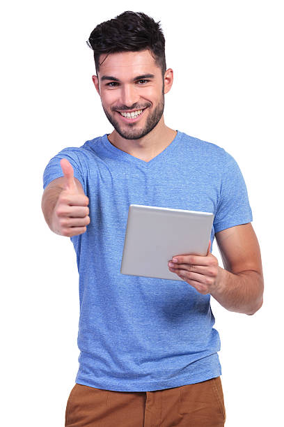istock casual man reading good news on his tablet pad 485613635