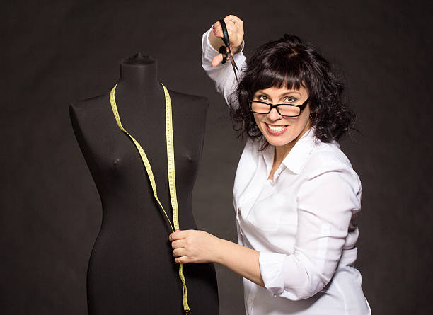 istock Adult tailor with mannequin 485614379