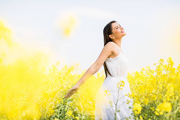 istock Young woman in the spring field 485614568