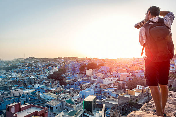 Photographer taking image of the Blue City rooftops, Jodhpur stock photo