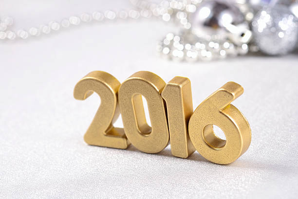 istock 2016 year golden figures and silvery Christmas decorations 485615512