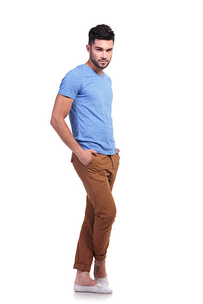 istock young man standing with his legs crossed 485615769