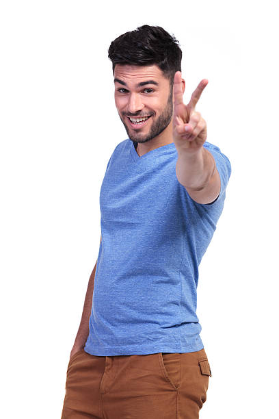 istock happy casual man making the victory sign 485615923