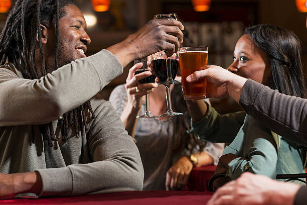 istock Group of multiracial friends drinking and toasting 485616506