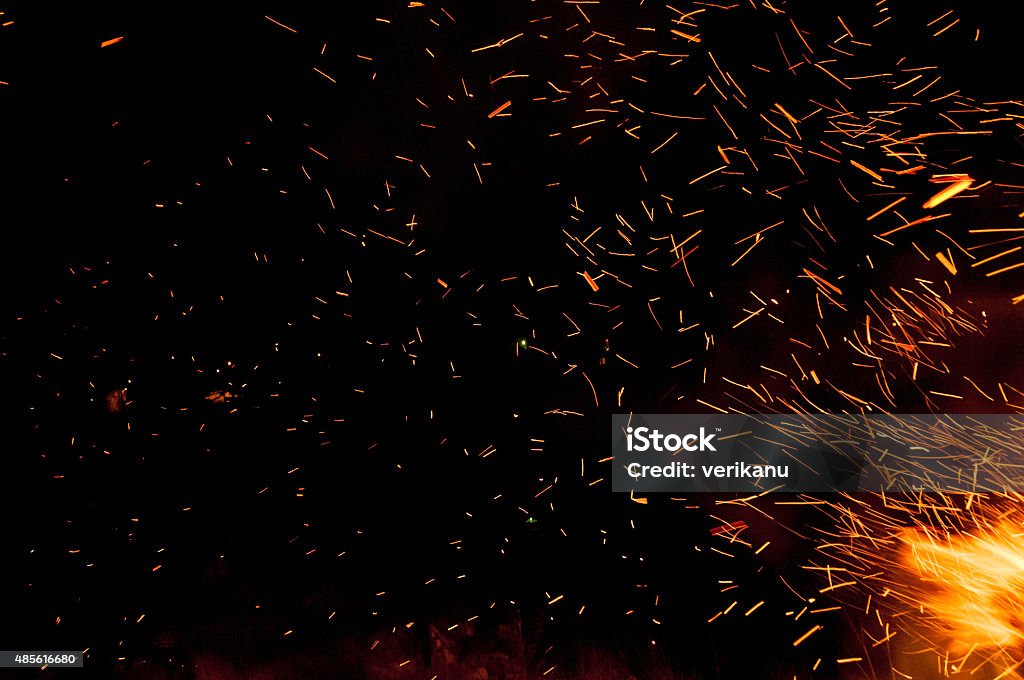 Traces of fire sparks Traces of fire sparks above a campfire Sparks Stock Photo