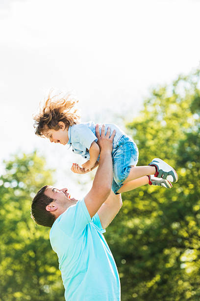 istock Playful father and son in nature. 485616854