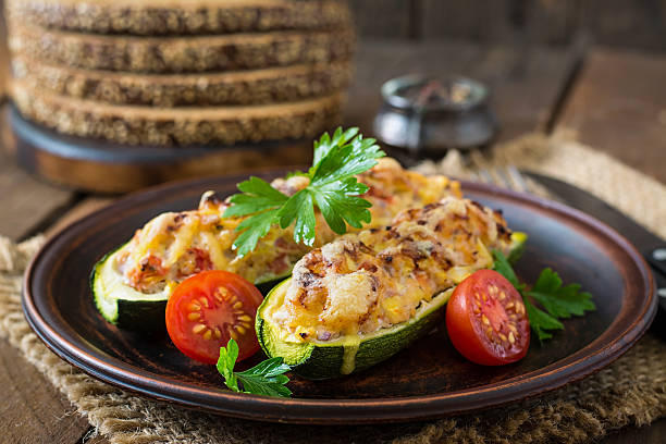 istock Stuffed zucchini with chicken, tomatoes and onion with cheese crust 485617028