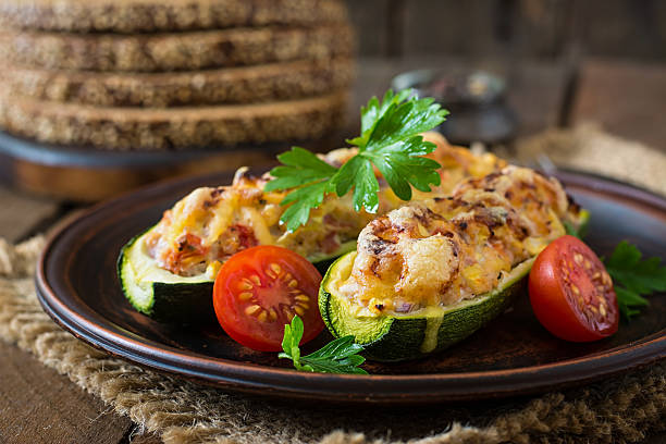istock Stuffed zucchini with chicken, tomatoes and onion with cheese crust 485617076