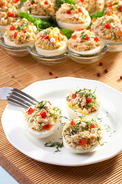istock stuffed eggs with ham, red pepper and dill 485617315