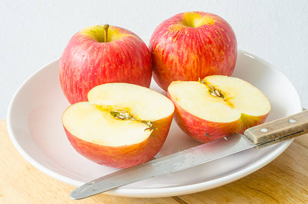 istock Red apples and apple slices on a white dish 485618224