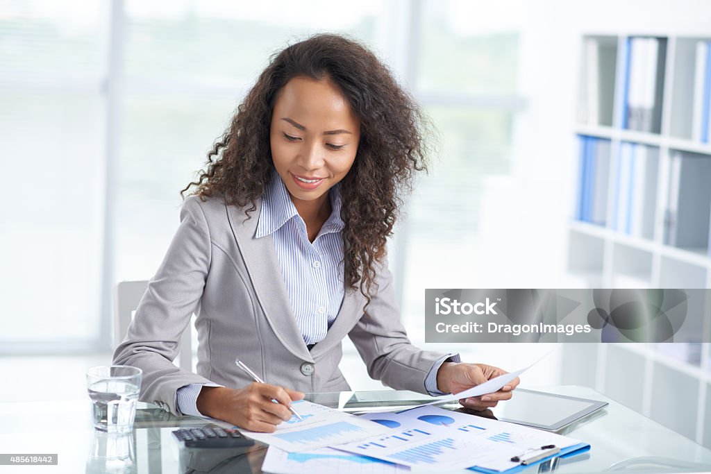 Busy with accounting Portrait of financial managers busy with accounting 2015 Stock Photo