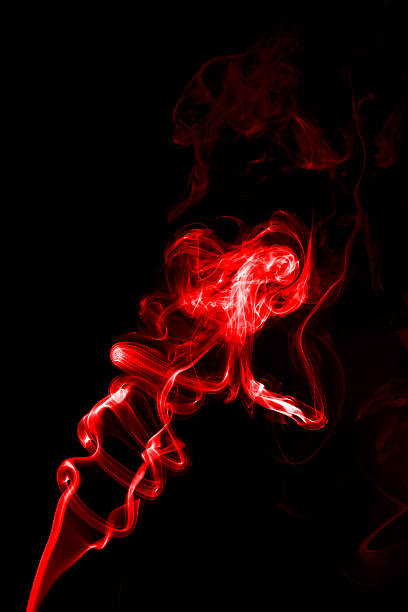 istock Red smoke on black blackground 485623760