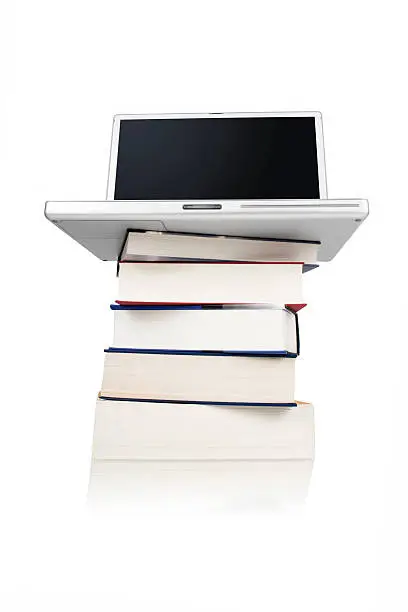 Stack of books with a Laptop - low angle view
