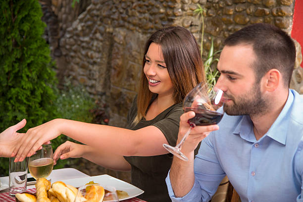 istock Smiling woman showing her manicure during lunch in restaurant. 485627220