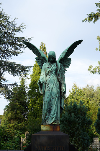 green angel on a grave