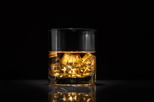 Luxury still life of whisky glass. Copyspace