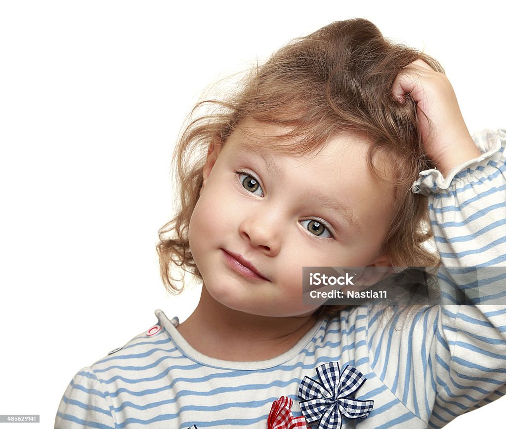 Cute small kid girl thinking holding the head. Isolated closeup Cute small kid girl thinking holding the head. Isolated closeup potrait on white Baby - Human Age Stock Photo